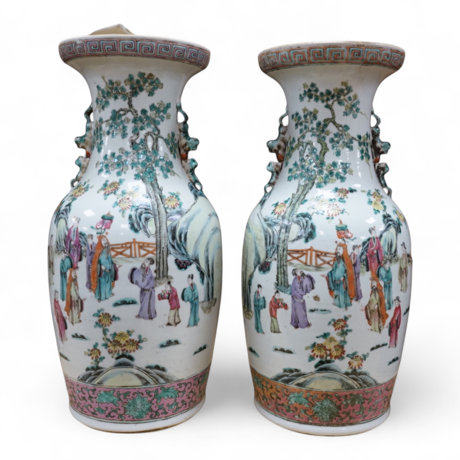 A pair of large late 19th century Chinese famille rose ‘scholars’ vases, 45cm high
